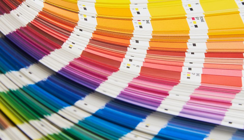 Brand guidelines applied across a website, an email and a social profile
